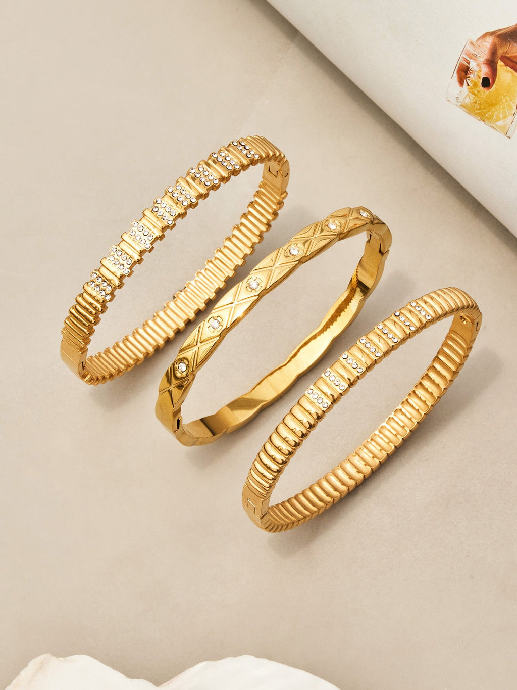Lucienne sleek gold bangle with sparkling stone detail, 316L stainless steel — Crown Crest Jewel