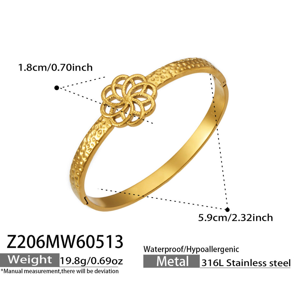 Fleura gold bangle with floral centrepiece, 316L stainless steel — Crown Crest Jewel